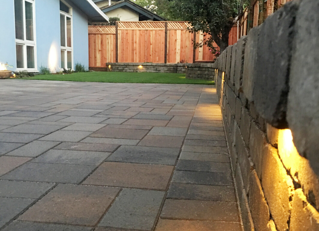 Beautiful concrete patio with integrated lighting at dusk in Torrington, CT